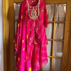 Vibrant Pink bandhni print Indian legends with long top with Gotta Patti.